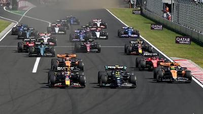 Max Verstappen overtakes Mercedes driver driver Lewis Hamilton at the start of the race. AP