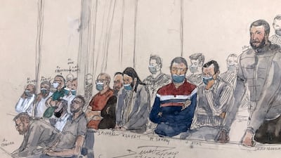 A court sketch shows Salah Abdeslam standing next to the 13 other defendants at Paris's Criminal Court during the trial over the November 2015 attacks. AFP.