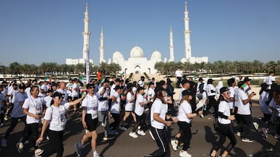 Thousands of people take part in a 5km run in Abu Dhabi aimed at strengthening solidarity in the UAE amid the impact of the US-Iran conflict. Getty Images