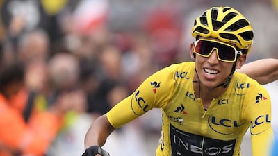 Colombia's Egan Bernal, wearing the overall leader's yellow jersey, celebrates as he crosses the finish line of the 20th stage of the 106th edition of the Tour de France in Val Thorens. AFP