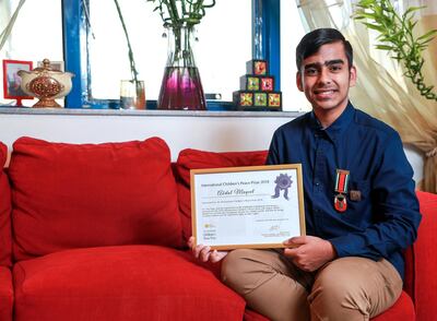 Abdul Muqeet with his certificate showing his nomination for an international prize for his work trying to encourage people to use fewer plastic bags. Victor Besa / The National