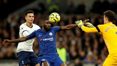 Tottenham Hotspur's Dele Alli is held off by Antonio Rudiger of Chelsea. Reuters