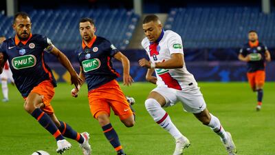 PSG's Kylian Mbappe in action with Montpellier's Hilton. Reuters