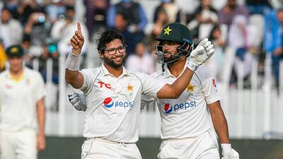 Pakistan's Imam-ul-Haq celebrates after scoring a century against Australia at the Rawalpindi Cricket Stadium. AFP