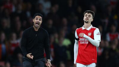 Arsenal manager Mikel Arteta reacts as Fabio Vieira passes by. Reuters
