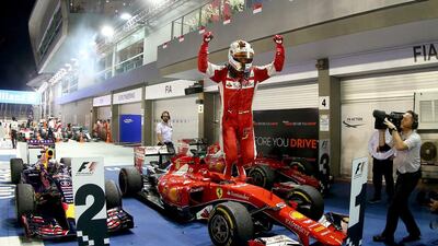 Sebastian Vettel celebrates after winning. Clive Rose / Getty Images