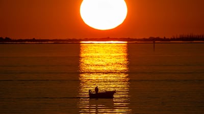 A boat at a sunset in the Grand Port Maritime de Marseille-Fos in Fos-sur-Mer, off the Mediterranean coast of southern France. AFP
