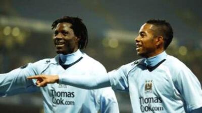 Benjani, left, celebrates with Robinho after scoring Manchester City's third goal.