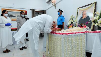 India's Prime Minister Narendra Modi pays his respects to Mukherjee. AFP