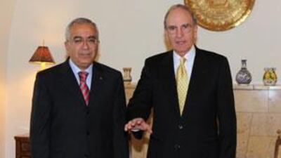 The US envoy George Mitchell, right, meets the Palestinian prime minister Salam Fayyad at the US Consulate in Jerusalem today.