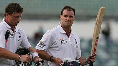 The England captain Andrew Strauss, right, raises his bat after his unbeaten knock guided the tourists to victory at the WACA.