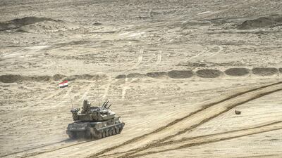An Egyptian tank ploughs through the battlefield. AFP