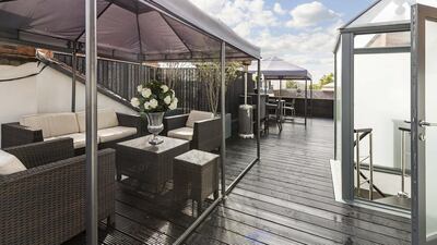 The 2,400 sq ft roof garden with a barbecue and a bar area.