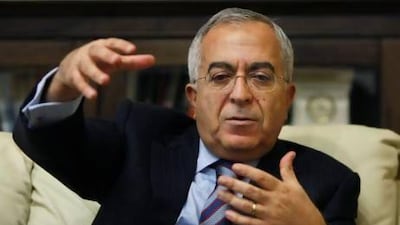 Palestinian Prime Minister Salam Fayyad gestures during an interview with The Associated Press in the West Bank city of Ramallah, Sunday, Jan. 6, 2013. Fayyad is blaming Arab countries that havenít delivered promised financial aid for an escalating financial crisis in the Palestinian territories. In an interview Sunday Fayyad said that the cash crunch is pushing an additional 25 percent of the Palestinian population, or 1 million people, into poverty. (AP Photo/Majdi Mohammed) *** Local Caption *** Mideast Israel Palestinians.JPEG-0569a.jpg