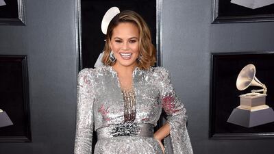 A pregnant Chrissy Teigen looked absolutely beautiful in this super shiny Yanina Couture dress. We love it when a mid-length dress is as go-big-or-go-home as any of the gowns. Evan Agostini / AP