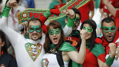 Portugal fans cheer as they wait for the start of the Euro 2016 quarter-final match between Poland and Portugal. Frank Augstein / AP Photo