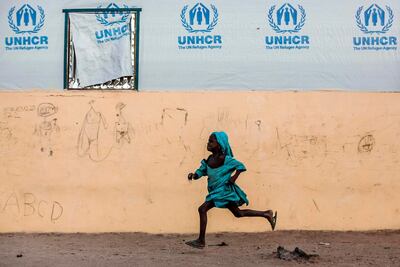 A girl runs at Malkohi refugee camp in Jimeta, Adamawa State, Nigeria. AFP