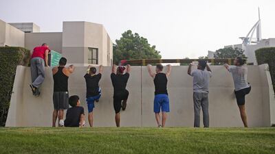 Stephane Vigroux (far left) goes over the techniques of wall climbing with the class. Lee Hoagland / The National