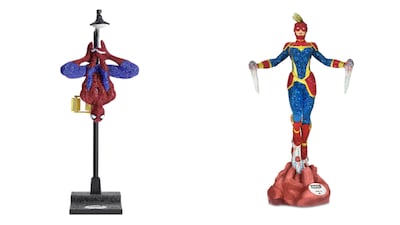 Two of the Marvel figurines include Spider-Man, left, which costs Dh84,467, and Captain Marvel, which costs Dh36,725. Photo: Swarovski