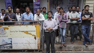 A reader pins hopes on the new Indian budget unveiled on Saturday. Above, people watch a display screen at the Bombay Stock Exchange. Rajanish Kakade / AP Photo