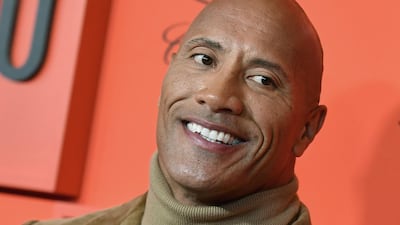 1) Dwayne 'The Rock' Johnson. Earnings: $89.4 million (Dh328.3) / AFP / ANGELA WEISS