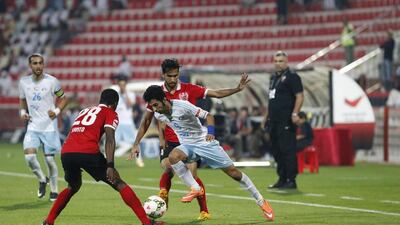Al Ahli coach Cosmin Olaroiu, right, looks on as his team played Baniyas to a scoreless draw on Saturday night in Dubai. Antonie Robertson / The National