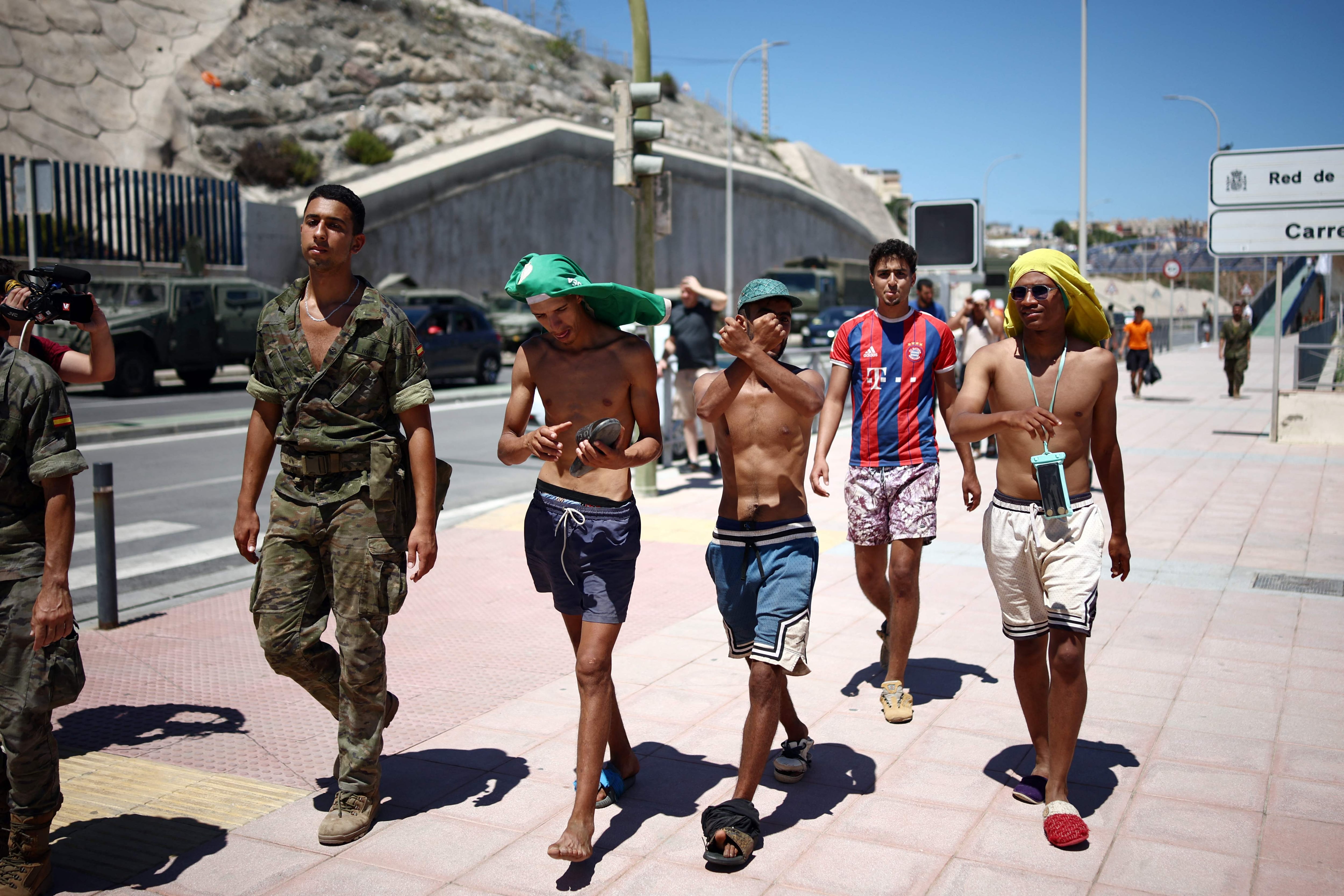 Image linked from the original feed: Morocco blames Ceuta migrant rush on misinformation and human trafficking networks