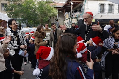 Cardinal Pierbattista Pizzaballa greets children during his visit to Gaza last week. AFP