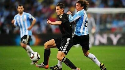Miroslav Klose, centre, and his German teammates played with a new verve against Argentina in the 2010 World Cup. Shaun Botterill / Getty Images