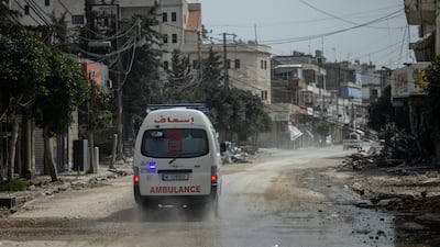 An ambulance crew responds after housing was destroyed by an Israeli air strike in Nabatieh, southern Lebanon. Getty Images