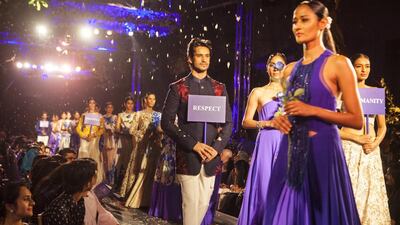 The female models took to the ramp wearing summery evening wear, including flowing gowns, jacket-saris, and sweeping long skirts, with beautifully intricate embroidery of flowers incorporated into many of the designs.