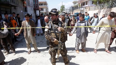 An Afghan security forces member stands guard at the site of a suicide bomb attack in Kabul, Afghanistan on April 22, 2018. Omar Sobhani / Reuters
