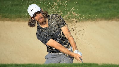 Tommy Fleetwood plays his second shot from a bunker on the 15th hole. Getty Images