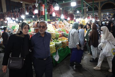Iran's currency has hit a record low amid the war with the US; seen here, shoppers at Tajrish Bazaar in Tehran. Reuters