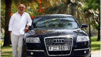 Youssef El Deeb, outside his office in Dubai, treasures his Audi A6, which he decided on after test driving both it and its larger counterpart, the A8. Satish Kumar for The National