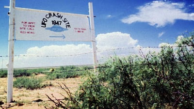 A sign off route US 285, north of Roswell, New Mexico, points west to the alleged 1947 crash site of a UFO.