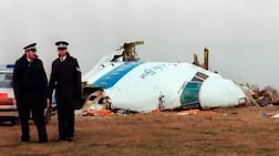 Police officers surrounded by the wreckage of the Pan Am flight 103 that exploded and crashed over Lockerbie, Scotland in 1988. AFP