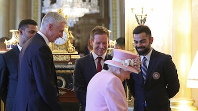 The Queen with England captain Eoin Morgan, centre, and India skipper Virat Kohli, right. AFP