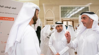 Sheikh Saif bin Zayed, Minister of Interior, speaks with a National Experts Programme graduate.