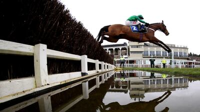 Adjali, ridden by Daryl Jacob, clears a fence during the James Henman Memorial Novices' Limited Handicap Chase at Ludlow Racecourse in England on Thursday, March 4. PA