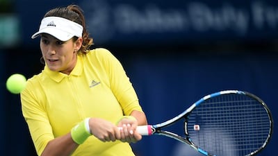 Garbine Muguruza of Spain plays a backhand against Kateryna Bondarenko of Ukraine during day three of the WTA Dubai Duty Free Tennis Championship at the Dubai Tennis Stadium on February 21, 2017 in Dubai, United Arab Emirates. Tom Dulat / Getty Images