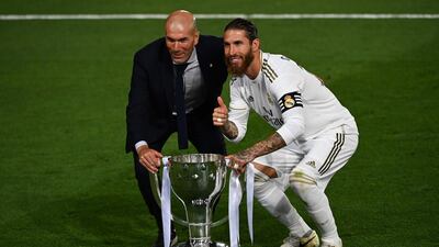 Real Madrid manager Zinedine Zidane and captain Sergio Ramos with the La Liga trophy. AFP