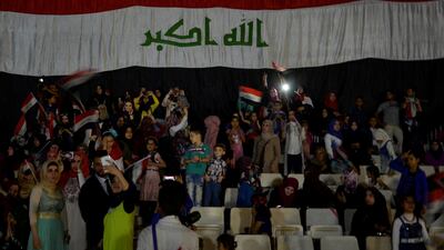 People celebrate Iraqi prime minister Haider Al Hadi's declaration of victory in Mosul on July 11, 2017. Further victory celebrations planned for Saturday have forced a Sunni conference on Iraqi post-war unityto be postponed. Reuters