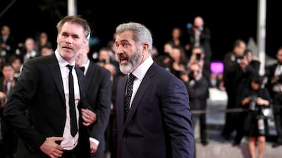 Director Jean-Francois Richet, left, with Mel Gibson. Photo by Andreas Rentz / Getty Images