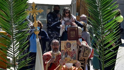 Lebanese Christians celebrate the traditional Palm Sunday procession as they walk in front of a Greek Catholic Church in the Museum area of Beirut. EPA