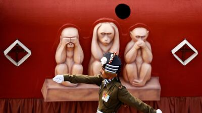 A soldier marches beside a tableau during the Republic Day parade in New Delhi. Adnan Abidi / Reuters