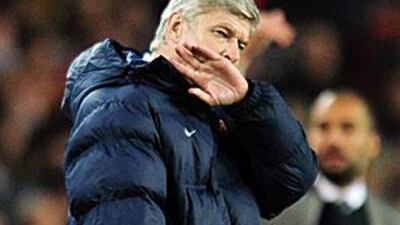 Arsene Wenger looks dejected after the Champions League quarter-final, second leg match at Camp Nou.