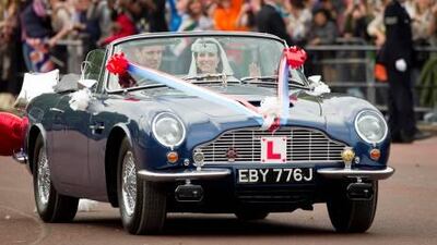 After the ceremony and the balcony appearance Prince William drove his wife, Kate, Duchess of Cambridge along The Mall in London in Prince Charles' Aston Martin Volante.