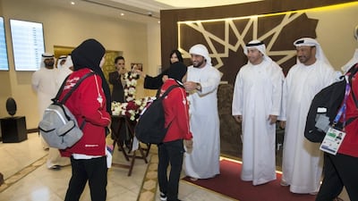 Sheikh Abdullah bin Mohammed bin Khalid Al Nahyan welcomes the UAE national jiu-jitsu team home from the Asian Games in Jakarta, Indonesia, at a reception at Abu Dhabi International Airport. Leslie Pableo / The National