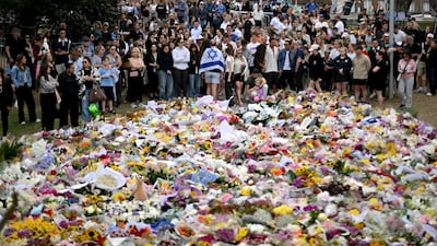 Mourners gather for a tribute at the Bondi Pavilion in memory of the shooting victims. AFP